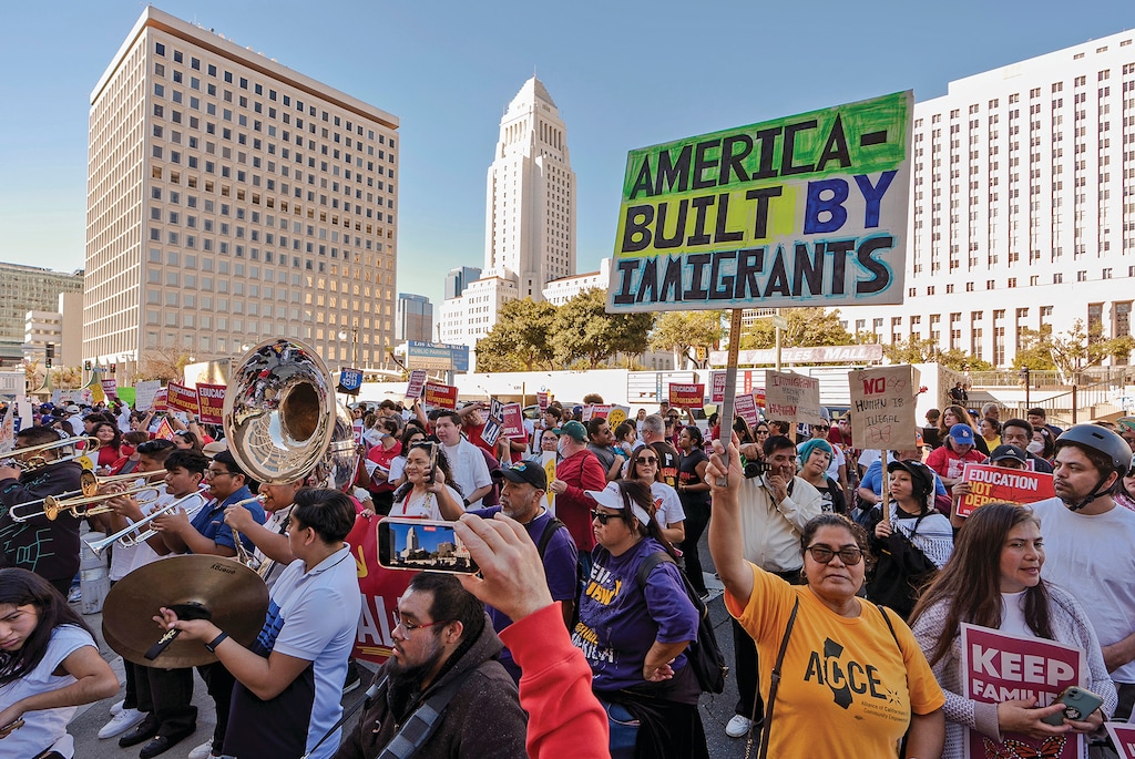 Immigrant rights and social justice organizations and migrant workers participate in a march for "International Day of Action and Solidarity with Migrants" in front of the Federal Building downtown Los Angeles, Wednesday, Dec. 18, 2024. (AP Photo/Damian Dovarganes)