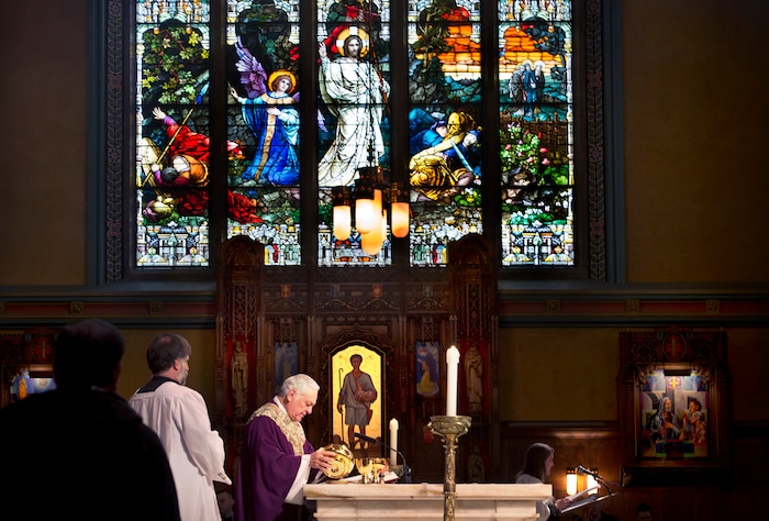 (Scott Sommerdorf   |  The Salt Lake Tribune)   The Reverend Martin Diaz, Rector and Pastor of The Cathedral of the Madeleine conducts the beginning of communion during the early morning Christmas Eve mass on the fourth Sunday of Advent at the Cathedral of the Madeleine, Sunday, December 24, 2017. 