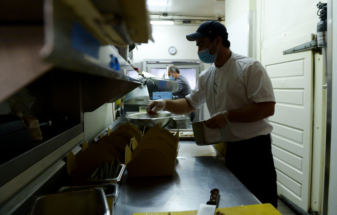 (Leah Hogsten  |  The Salt Lake Tribune) Trio restaurant owner Mikel Trapp and executive chef Lloyd Kianfar prepare Summer Grain Salads to feed frontline workers June 3, 2020. Since March, the Helping Heroes program, launched by Utah restaurant food supplier, Nicholas & Co., has been taking food originally planned for restaurants and using it to feed frontline COVID-19 workers across the Wasatch Front.