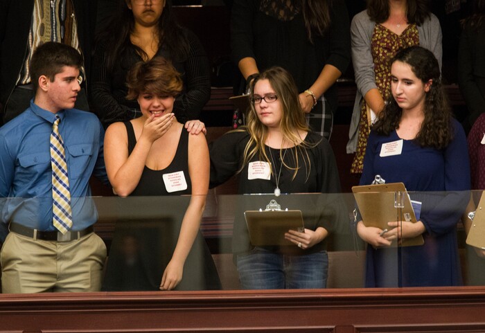 Sheryl Acquarola, a 16 year-old junior from Marjory Stoneman Douglas High School is overcome with emotion in the east gallery of the House of Representatives after the representatives voted not to hear the bill banning assault rifles and large capacity magazines at the Florida Capital in Tallahassee, Fla., Tuesday, Feb 20, 2018. Acquarola was one of the survivors of the Marjory Stoneman Douglas High School shooting that left 17 dead, who were in Tallahassee channeling their anger and sadness into action. (AP Photo/Mark Wallheiser)