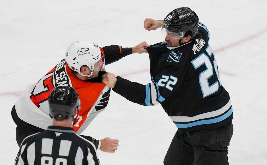 (Bethany Baker  |  The Salt Lake Tribune) Utah Mammoth center Jack McBain (22) and Philadelphia Flyers defenseman Noah Juulsen (47) fight during a game earlier this season.