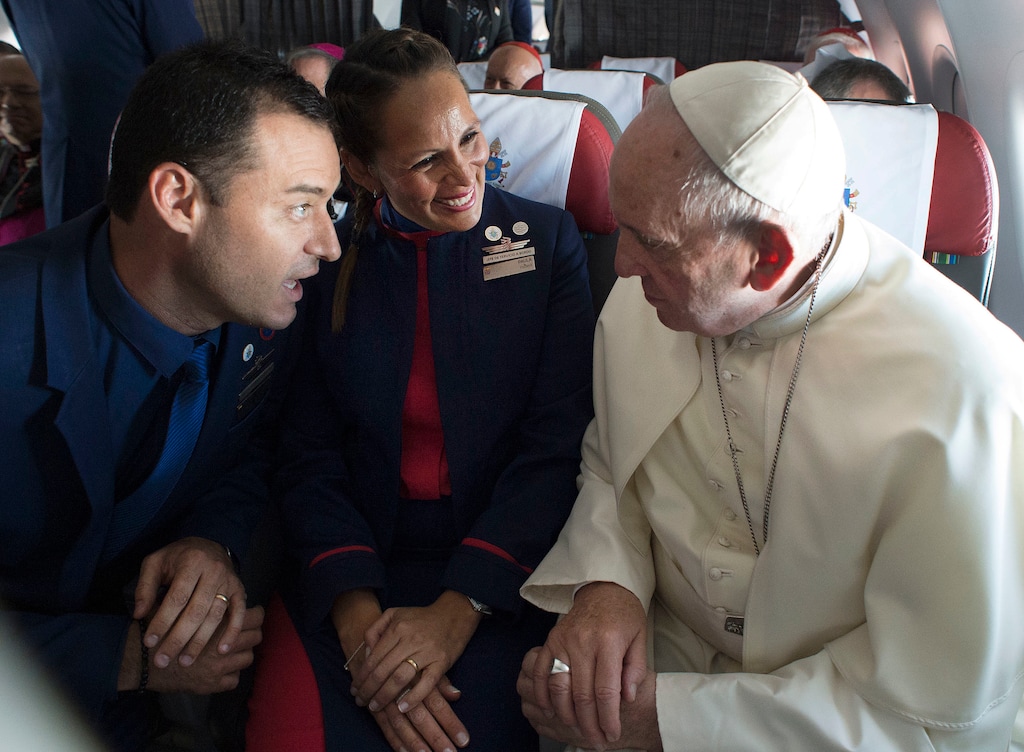 (L'Osservatore Romano Vatican Media/Pool Photo via AP) Pope Francis marries flight attendants Carlos Ciuffardi, left, and Paola Podest, center, during a flight from Santiago, Chile, to Iquique, Chile, in 2018. The pope has said that "sexual pleasure is there to make love more beautiful" for couples.