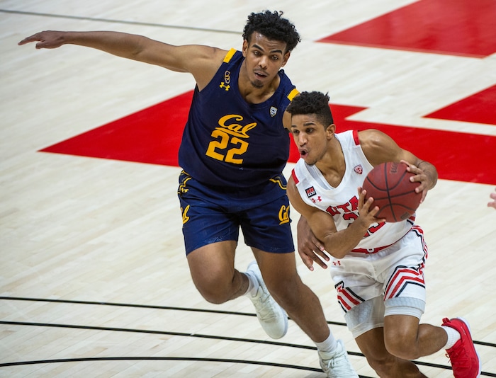 (Rick Egan | The Salt Lake Tribune) Utah Utes guard Alfonso Plummer (25) gets past California Golden Bears forward Andre Kelly (22), in PAC12 Basketball action between the Utah Utes and the California Golden Bears, on Wednesday, Jan. 16, 2021.