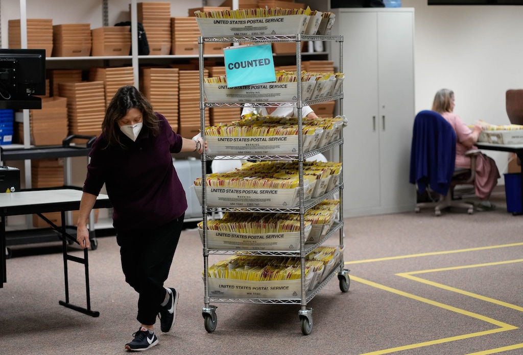 (Francisco Kjolseth | The Salt Lake Tribune) Election workers sort vote-by-mail ballots at the Salt Lake County ballot processing center on Tuesday, Nov. 8, 2022.