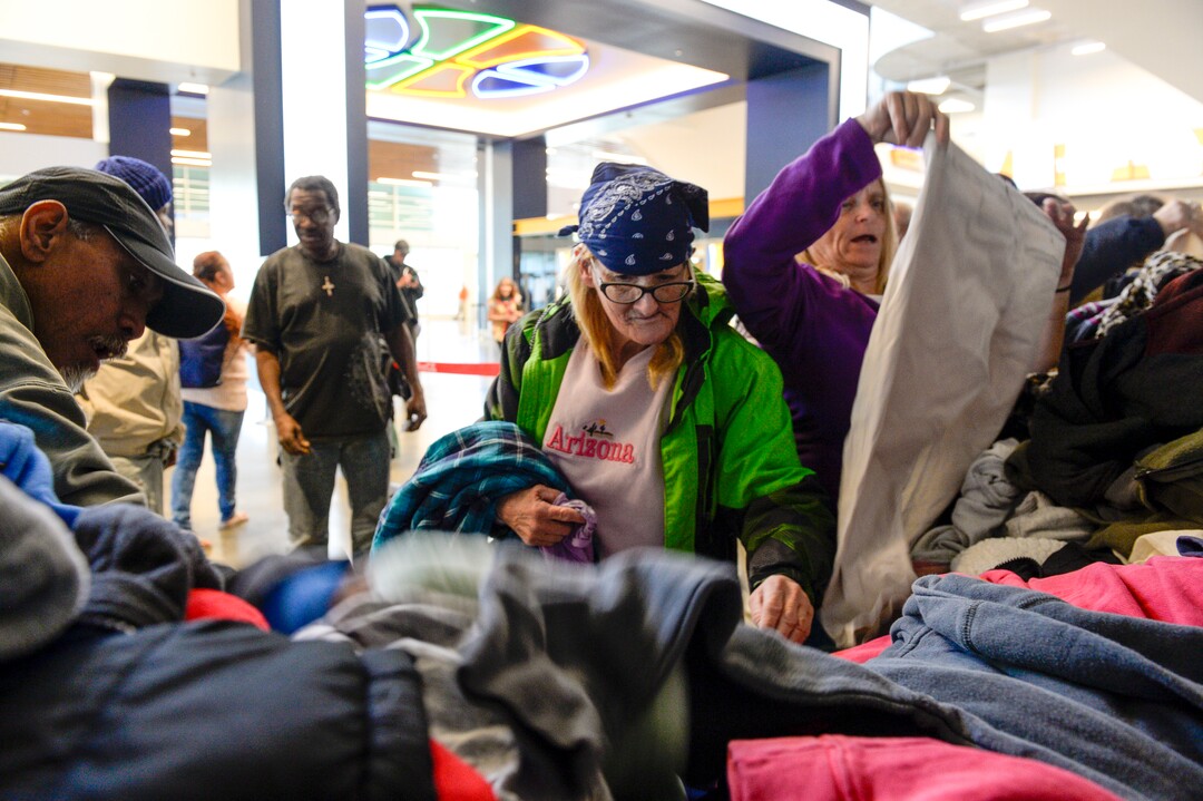 Leah Hogsten  |  The Salt Lake Tribune Local homeless and low-income families were given a hot Thanksgiving dinner, shoes and clothing at the Utah Jazz and the Larry H. Miller Group sponsored annual “We Care – We Share” benefit, Monday, Nov 19, 2018.