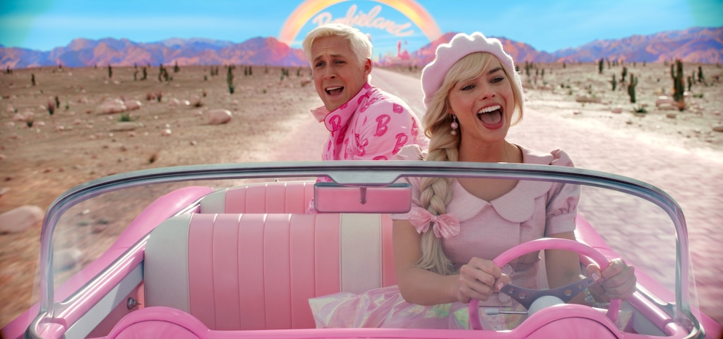(Warner Bros. Pictures) Barbie (Margot Robbie, front) drives her pink Corvette out of BarbieLand, with Ken (Ryan Gosling) as a stowaway, in director Greta Gerwig's "Barbie." The movie has messages for Latter-day Saints and others about patriarchy and perfectionism.