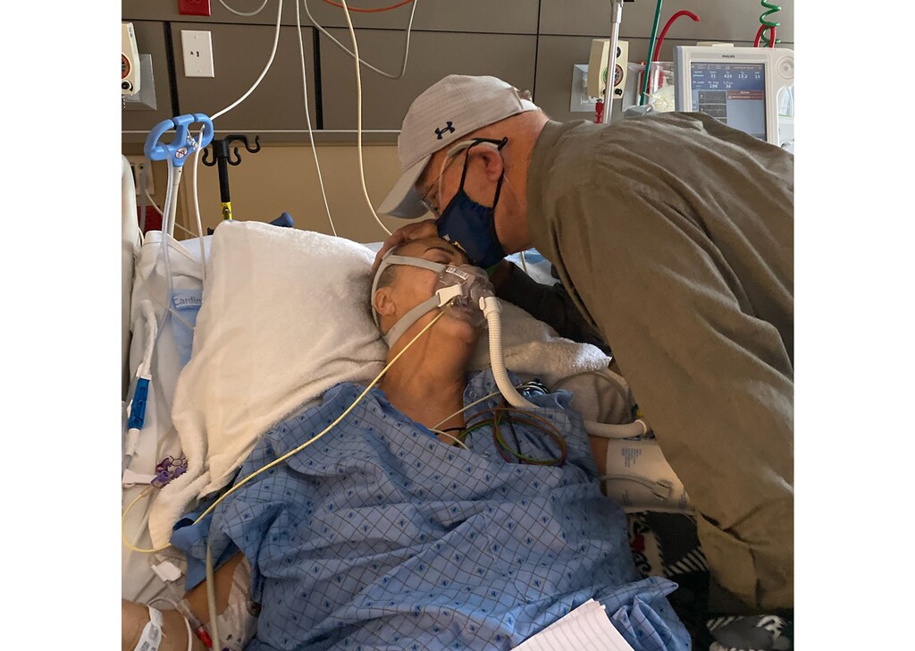 (Photo courtesy of Lindsay Wootton) Chad Larsen kisses his wife, Tracy Larsen, on their anniversary on Oct. 25, 2020. The Larsens both were diagnosed with COVID-19 and had long hospital stints. Tracy Larsen died in the hospital on Oct. 29, 2020.