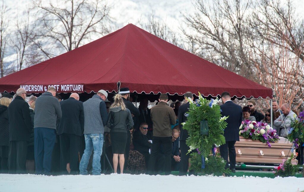 (Rick Egan | The Salt Lake Tribune)    Friends and loved ones gather for the graveside service for Laurie Holt at the Crescent Cemetery in Sandy. Holt spent nearly two years pushing to get her son Josh freed from a Venezuelan jail. Saturday, Feb. 16. 2019