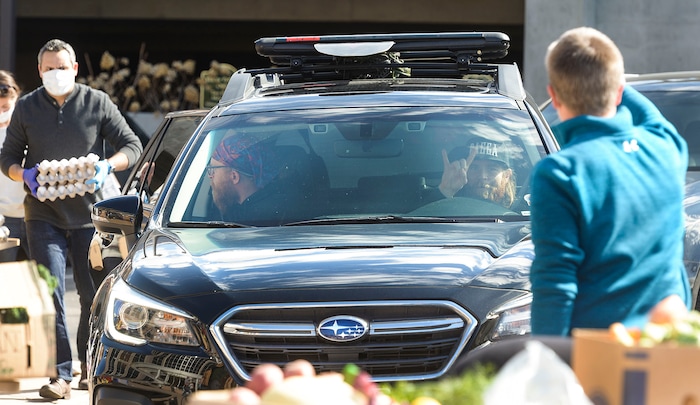 (Leah Hogsten  |  The Salt Lake Tribune)  Snowbird employees handed out over 10,000 pounds of perishable items from the ski resort's restaurants and stores to their workforce, March 21, 2020. The food included milk, eggs, bread, cheeses, every kind of herb, vegetable and fruit, including kumquats and lemon grass, and was given to Snowbird employees on a first-come, first-served basis.