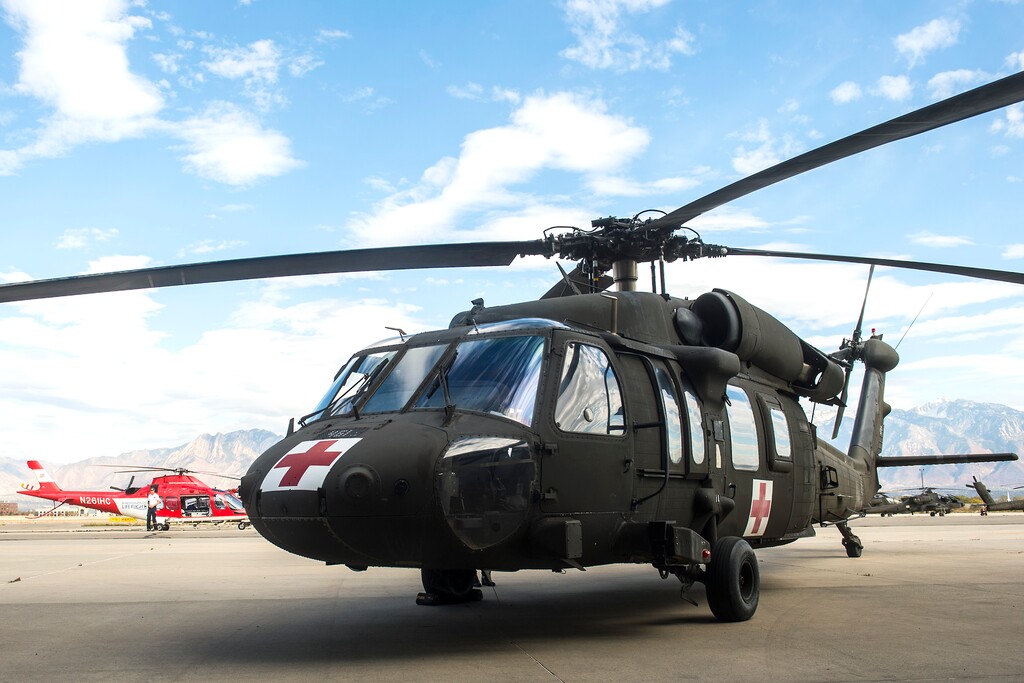 (Chris Detrick | The Salt Lake Tribune)
The Black Hawk and Intermountain Life Flight helicopters used in the rescue operation as seen at Utah National Guard's Army Aviation Support Facility Thursday, October 19, 2017. Pilots and crew from the Guard were able to hover in the dark canyon and hoist the injured hiker onto the Black Hawk about 11 p.m. Wednesday. The injured hiker was located about a third of the way up the north face of the mountain, at the bottom of Anderson pass at Henry Fork.
