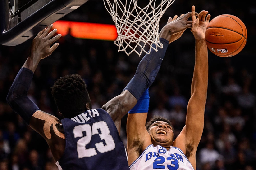 (Trent Nelson | The Salt Lake Tribune)  Utah State Aggies center Neemias Queta (23) blocks a shot by Brigham Young Cougars forward Yoeli Childs (23) as BYU hosts Utah State, NCAA basketball in Provo on Wednesday Dec. 5, 2018.