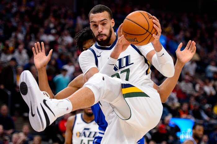 (Trent Nelson  |  The Salt Lake Tribune) Utah Jazz center Rudy Gobert (27) pulls in a rebound as the Utah Jazz host the Sacramento Kings, NBA basketball in Salt Lake City on Saturday, Jan. 18, 2020.