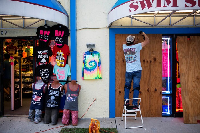 (David Goldman | The Associated Press)  Jone Yoon boards up his beach souvenir shop ahead of Hurricane Irma in Daytona Beach, Fla., Thursday, Sept. 7, 2017. South Florida officials are expanding evacuation orders as Hurricane Irma approaches, telling more than a half-million people to seek safety inland.