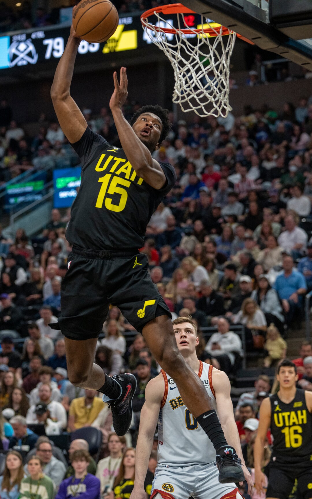 (Rick Egan | The Salt Lake Tribune) Utah Jazz center Damian Jones (15) goes in for a dunk, in NBA action between the Utah Jazz and the Denver Nuggets at Vivint Arena,  Saturday, April 8, 2023.