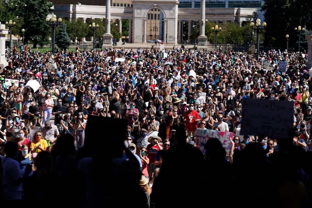 (David Zalubowski | AP file photo)  Demonstrators crowd into Civic Center Park during a rally calling for more oversight of the police Sunday, June 7, 2020, in Denver. Demonstrators marched from the park, which is in the heart of downtown, east along Colfax Avenue to City Park after the rally.