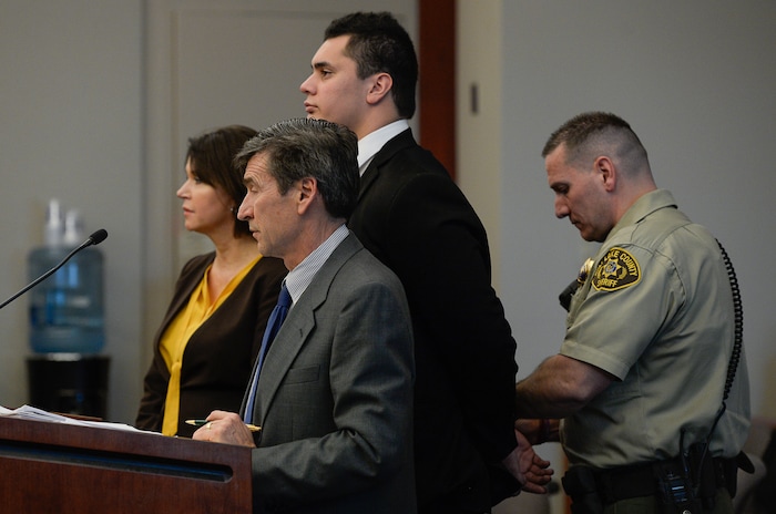 (Francisco Kjolseth  |  The Salt Lake Tribune)  Former Brighton High and University of Southern California linebacker Osa Masina, center, is taken into custody while standing with his defense attorney's Greg and Rebecca Skordas during his sentencing for sexual battery at the Matheson Courthouse in Salt Lake City on Tuesday, Dec. 5, 2017. Masina was sentenced to 365 days in jail, followed by two years on probation.