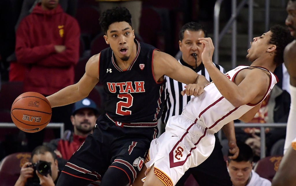 Utah guard Sedrick Barefield, left, knocks over Southern California guard Derryck Thornton on a drive during the first half of an NCAA college basketball game Wednesday, Feb. 6, 2019, in Los Angeles. (AP Photo/Mark J. Terrill)