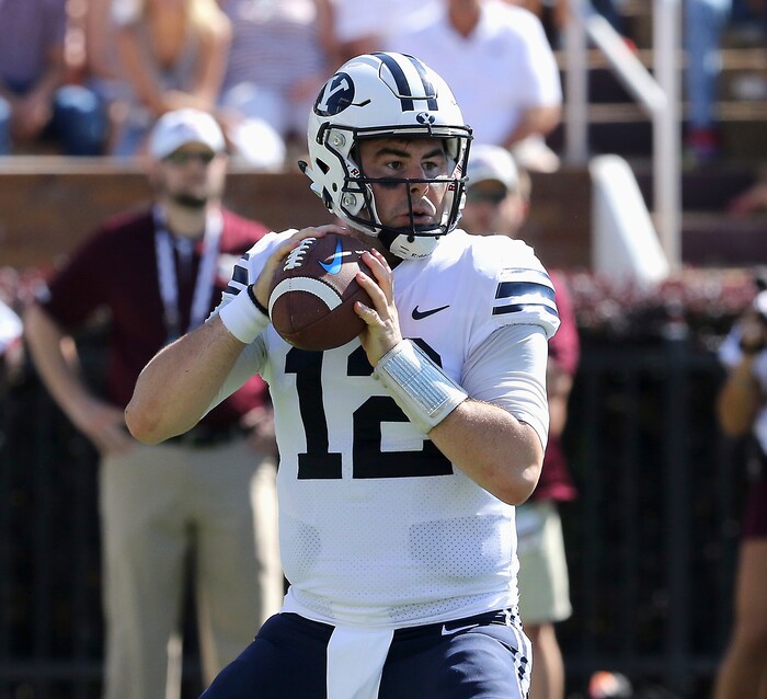 BYU quarterback Tanner Mangum (12) looks to pass during the first half of an NCAA college football game against Mississippi State in Starkville, Miss., Saturday, Oct. 14, 2017. (AP Photo/Jim Lytle)