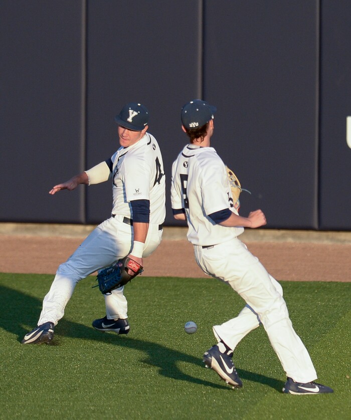 (Leah Hogsten  |  The Salt Lake Tribune) BYU's outfielders Brock Hale and Jarrett Perns try to get a glove on Utah's Matt Ricardson's hit as Brigham Young University hosts University of Utah at Miller Park, Tuesday, April 24, 2018 in Provo.