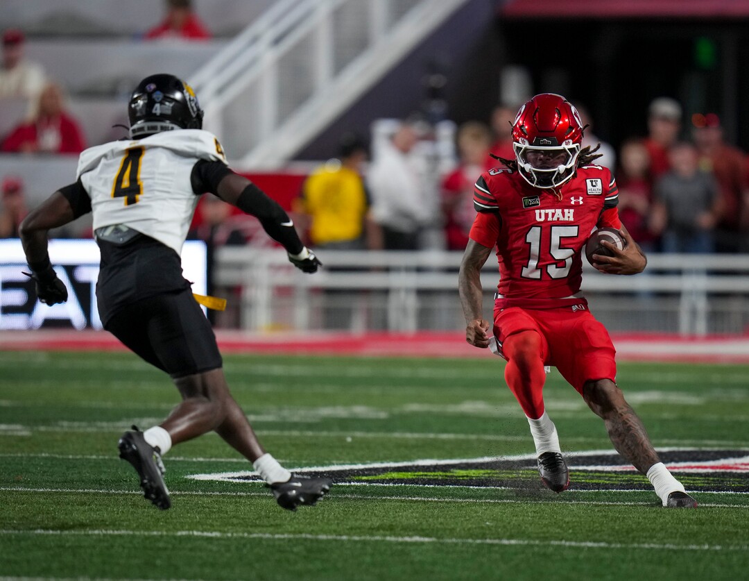 (Bethany Baker  |  The Salt Lake Tribune) Utah Utes quarterback Byrd Ficklin (15) avoids a tackle from Idaho Vandals defensive back Khaled Rawls (4) during the first half of the game between the Utah Utes and the Idaho Vandals at Rice-Eccles Stadium in Salt Lake City on Thursday, Sept. 3, 2026.