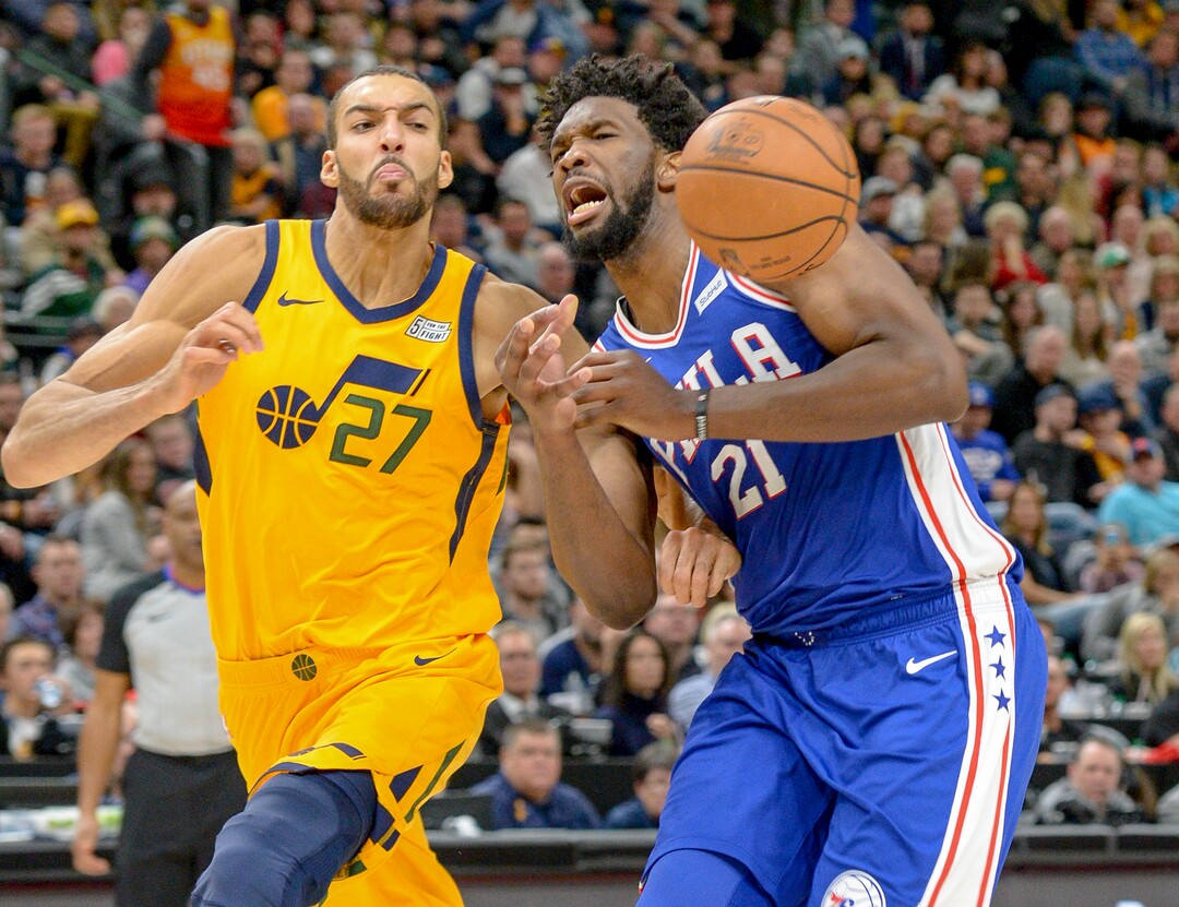 Leah Hogsten  |  The Salt Lake Tribune  Utah Jazz center Rudy Gobert (27) battles Philadelphia 76ers center Joel Embiid (21). The Philadelphia 76ers defeated the Utah Jazz 114- 97 at Vivint Smart Home Arena, Thursday, December 27, 2018. 