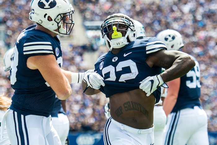 (Chris Detrick  |  The Salt Lake Tribune) Brigham Young Cougars running back Squally Canada (22) celebrates after scoring a touchdown during the game at LaVell Edwards Stadium Saturday, August 26, 2017.