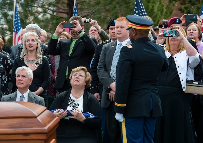 (Rick Egan  |  The Salt Lake Tribune)     Ronald Turner and his wife Mary Ann Turner, the daughter of 2nd Lt. Lynn W. Hadfield, watch the helicopter fly-over during the graveside service for her father, who was killed during the Second World War, at Veterans Memorial Park, in Bluffdale. Thursday, March 21, 2019.


