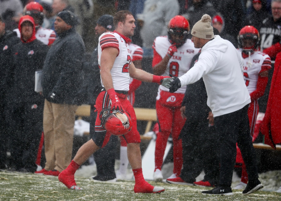 Utah linebacker Chase Hansen, left, heads off the field after he was ejected for targeting while sacking Colorado quarterback Steven Montez in the first half of an NCAA college football game Saturday, Nov. 17, 2018, in Boulder, Colo. (AP Photo/David Zalubowski)