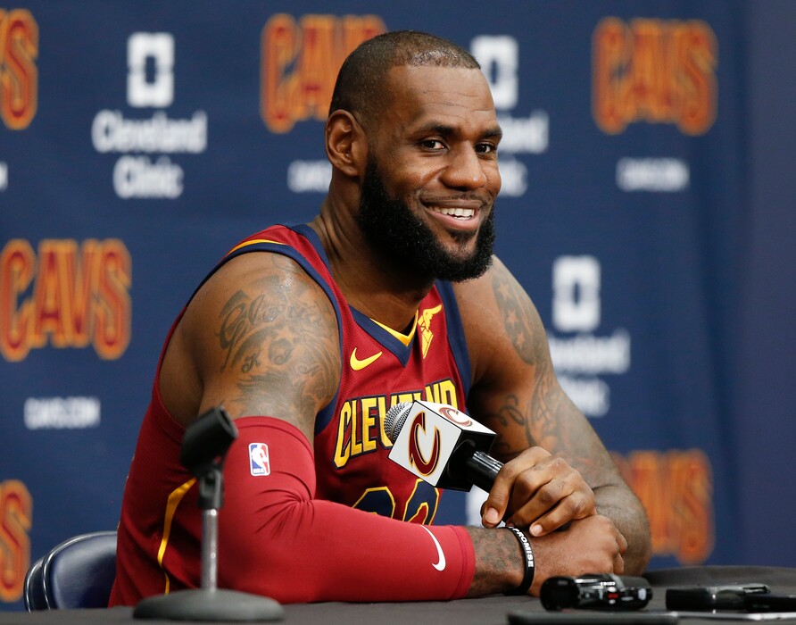 Cleveland Cavaliers' LeBron James answers questions during the NBA basketball team media day, Monday, Sept. 25, 2017, in Independence, Ohio. (AP Photo/Ron Schwane)