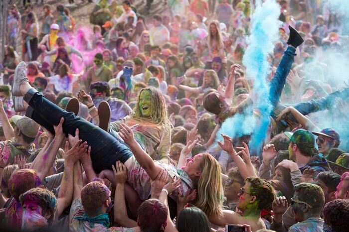 (Rick Egan  |  The Salt Lake Tribune)     Revelers crowd surf as colors fly during the 22nd annual Holi Festival of Colors at the Sri Sri Radha Krishna Temple in Spanish Fork, Saturday, March 24, 2018.