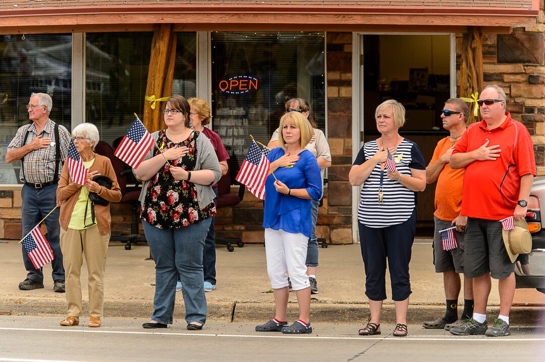 (Trent Nelson | The Salt Lake Tribune)  Crowds line Main Street in Monticello to honor the motorcade of fallen soldier Aaron Butler, who was killed last week in Afghanistan, , Thursday August 24, 2017.