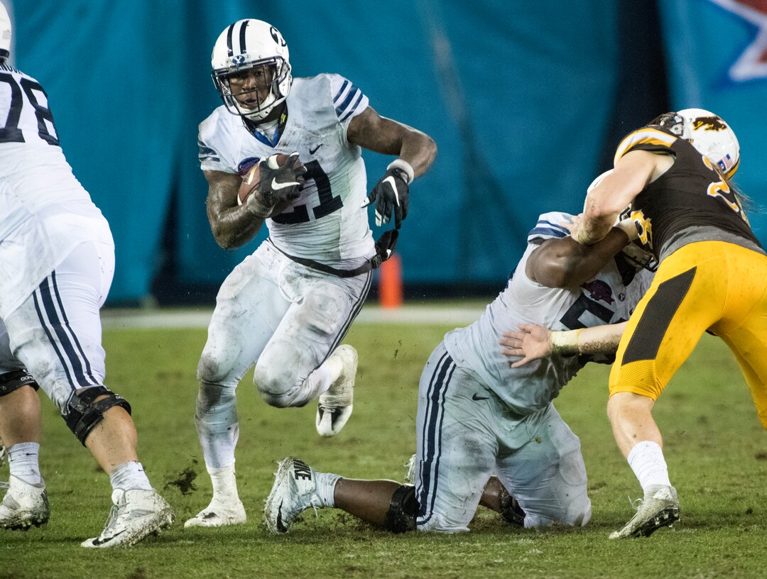 Rick Egan  |  The Salt Lake TribuneBrigham Young offensive lineman Tuni Kanuch (78) and offensive lineman Tejan Koroma (56) open up a hole for running back Jamaal Williams (21) to run for a 36-yard touchdown for the Cougars, in the Poinsettia Bowl, at Qualcomm Stadium in San Diego, December 21, 2016.
