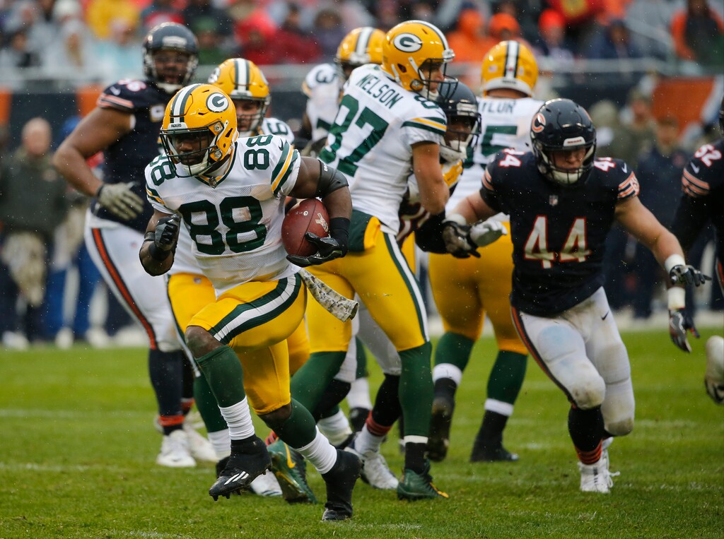 Green Bay Packers running back Ty Montgomery (88) breaks away from the Chicago Bears defense for a touchdown during the first half of an NFL football game, Sunday, Nov. 12, 2017, in Chicago. (AP Photo/Charles Rex Arbogast)