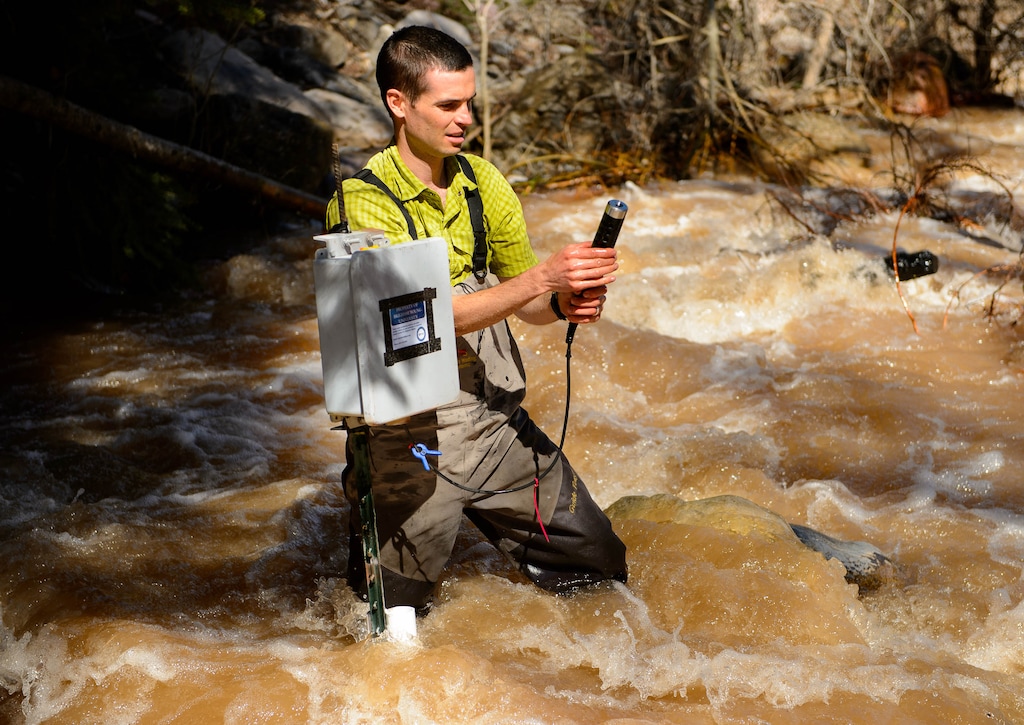(Trent Nelson | The Salt Lake Tribune)
Ben Abbott, Assistant Professor of Ecosystem Ecology at BYU, checks the status of a water monitoring station on a Utah Lake tributary in Payson Canyon on Thursday April 25, 2019. A leading critic of a proposal to dredge Utah Lake, the project's proponents have filed a $3 million lawsuit against him.