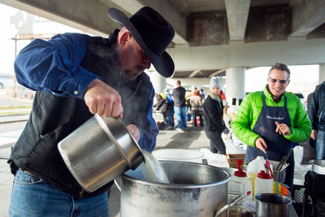 (Chris Detrick  |  The Salt Lake Tribune)  Eagles Ranch Ministries chaplain Eric Burson makes stuffing during the Eagle Ranch Chuckwagon under the viaduct at 500 South and 600 West in Salt Lake City Thursday, November 23, 2017.  
