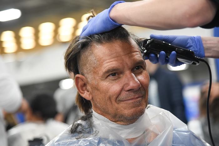(Francisco Kjolseth  |  The Salt Lake Tribune)  Shane Rudy gets a trim as part of Salt Lake CityÕs second annual Project Homeless Connect at the Salt Palace Convention Center on Friday, Oct. 12, 2018, that brings together community volunteers to provide services for individuals and families experiencing homelessness. More than 800 community volunteers and 90 service providers connect those in need with more than 200 services.