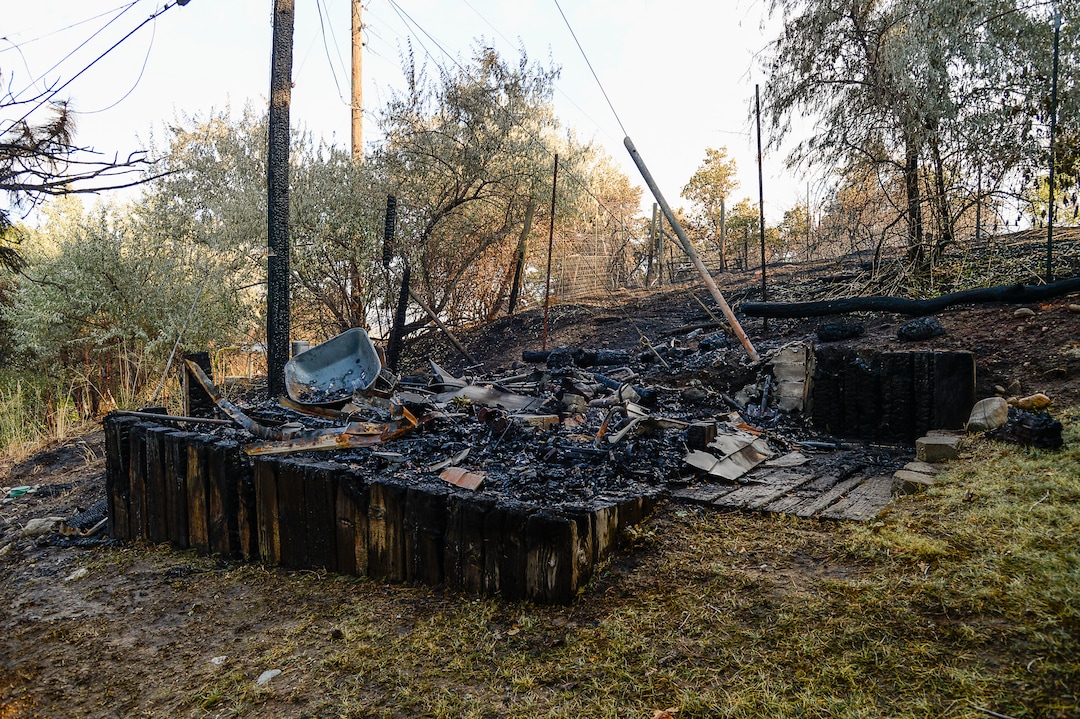 (Francisco Kjolseth  |  The Salt Lake Tribune)  A shed smolders  belonging to Alysa Albertine who recalled the harrowing experience of having to flee her home in East Bountiful when a wildfire ignited in the early hours on Friday morning, Aug. 30, 2019. The fire was so close her shed was destroyed and three of her neighbors experienced a total loss of their homes. On Sept. 2, officials said the fire was 100% contained.