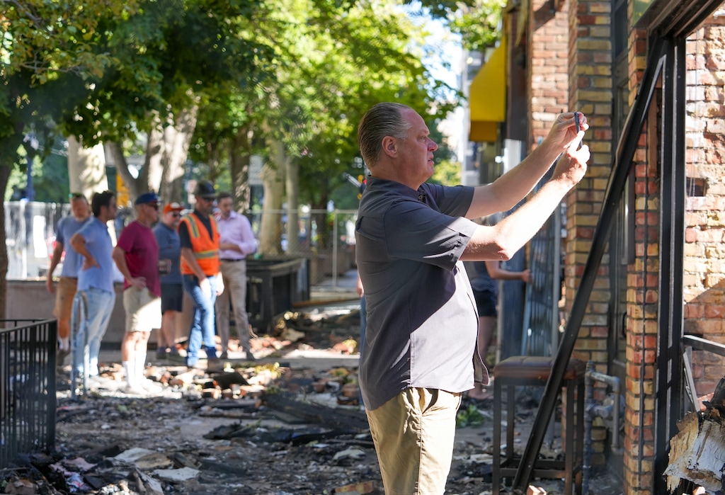 (Chris Samuels | The Salt Lake Tribune) Jason LeCates, one of the managing partners of Whiskey Street and the White Horse on Main, surveys the damage caused by a fire on Main Street in Salt Lake City, Wednesday, Aug. 13, 2025.
