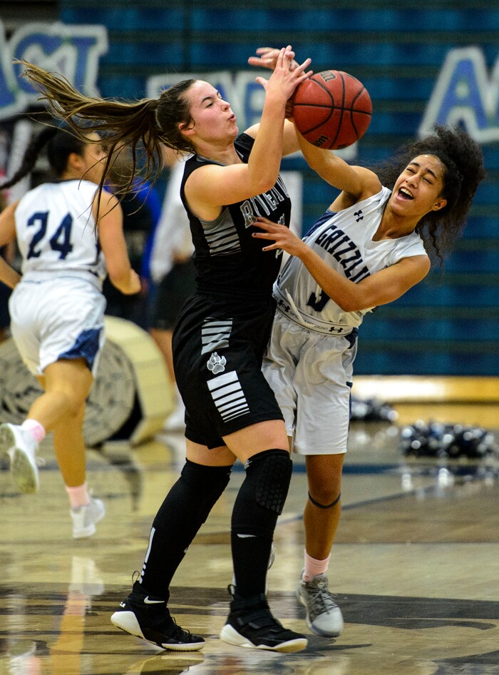 (Steve Griffin  |  The Salt Lake Tribune)  Riverton's Matty McDonald, left, and Copper Hill's guard Eleyana Tafisi battle for the ball during the Riverton versus Copper Hills girl's basketball game at Cooper Hill s High School in West Jordan Thursday February 1, 2018.