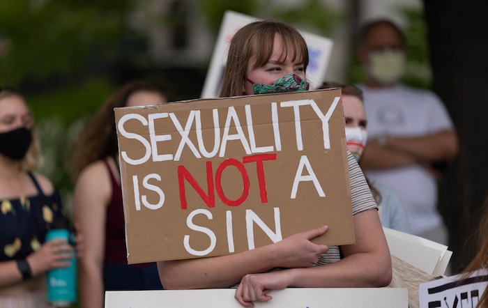 (Francisco Kjolseth | The Salt Lake Tribune) Abigail Olds joins dozens of protesters petitioning the First Presidency to repeal the excommunication of Natasha Helfer, a sex therapist who lost her membership in The Church of Jesus Christ of Latter-day Saints. "Out of respect for Natasha, this is a protest against the decision of the council, not a protest against the Church,” as they gathered outside the Church offices in a peaceful protest on Friday, May 7, 2021.