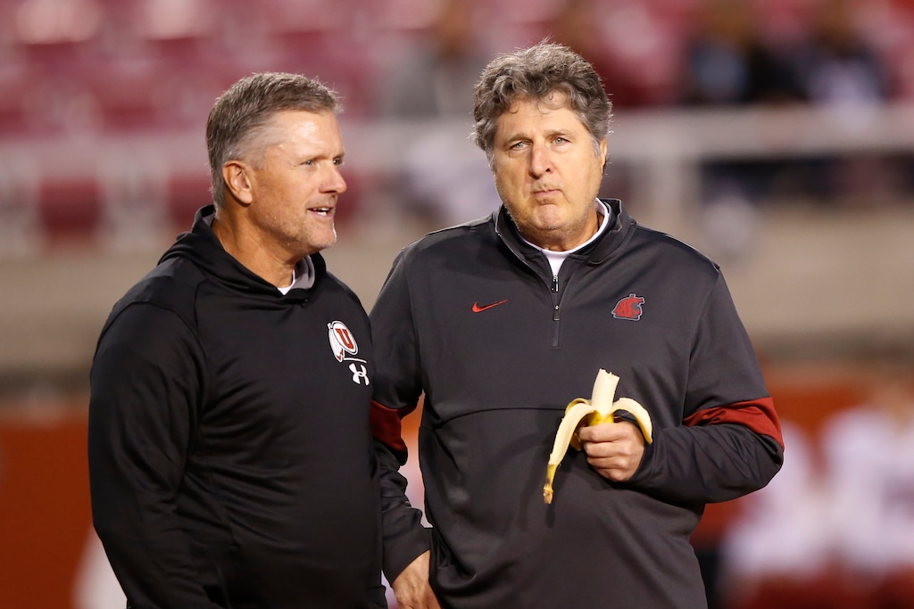 Utah head coach Kyle Whittingham, left, and Washington State head coach Mike Leach talk before the start of their NCAA college football game Saturday, Sept. 28, 2019, in Salt Lake City. (AP Photo/Rick Bowmer)