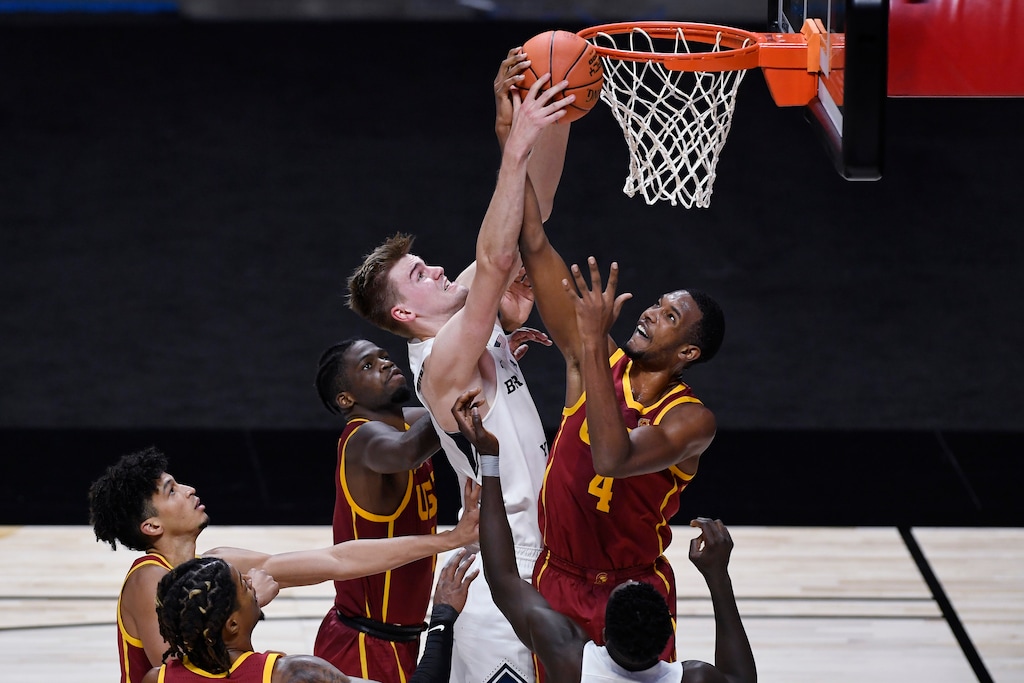 BYU's Matt Haarms, top left, and Southern California's Evan Mobley, top right, fight for a rebound in the second half of an NCAA college basketball game, Tuesday, Dec. 1, 2020, in Uncasville, Conn. (AP Photo/Jessica Hill)