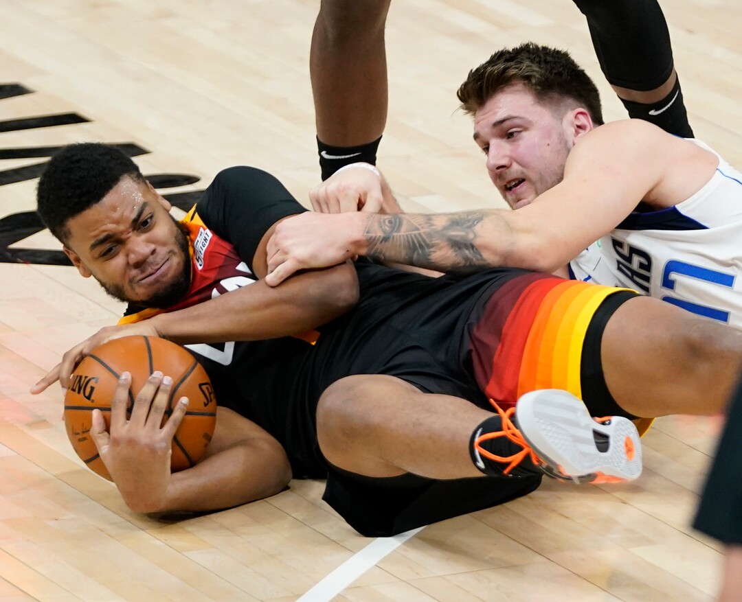 (Rick Egan | The Salt Lake Tribune)  Utah Jazz forward Juwan Morgan (16) goes for a loose ball along with Dallas Mavericks guard Luka Doncic (77), in NBA action between the Utah Jazz and the Dallas Mavericks at Vivint Arena, on Friday, Jan. 29, 2021.