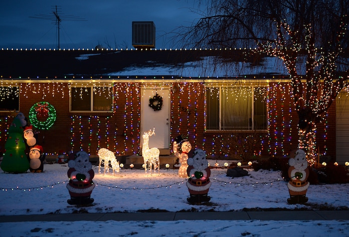 (Scott Sommerdorf | The Salt Lake Tribune)
A view of some of the houses on Royalwood Drive in Taylorsville, Friday, December 22, 2017. "Christmas Street" is a Taylorsville neighborhood where residents up and down the street decorate their homes every year with Christmas lights. The United States uses more electricity for Christmas lights than some countries use all year.