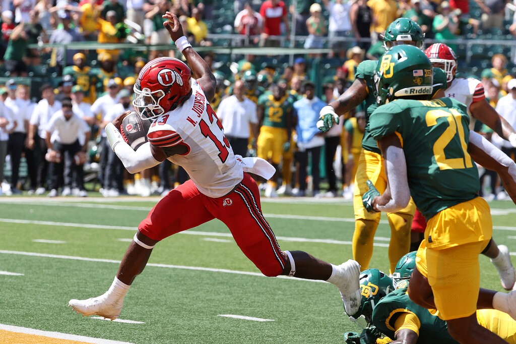 Utah quarterback Nate Johnson (13) scores a touchdown against Baylor in the second half of an NCAA college football game, Saturday, Sept. 9, 2023, in Waco, Texas. (AP Photo/Jerry Larson)