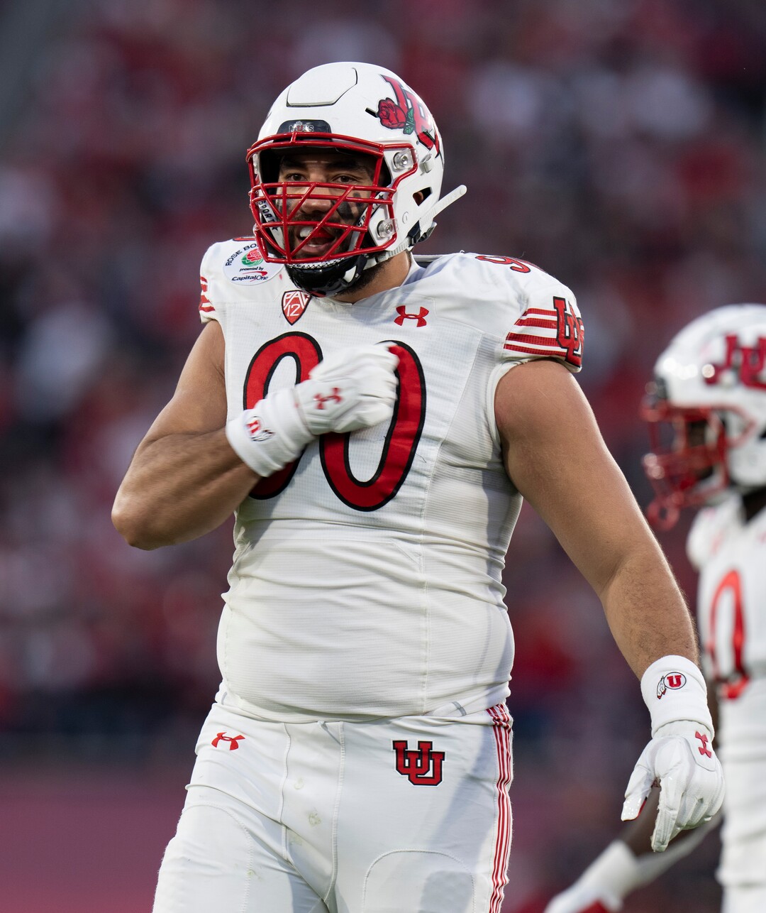 (Rick Egan | The Salt Lake Tribune) Utah Utes defensive tackle Devin Kaufusi (90) pounds his chest trying to get the ground to make some noise in the second half, in Rose Bowl action between the  Utah Utes and the Ohio State Buckeyes Pasadena, on Saturday, January 1, 2022.