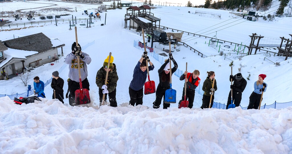 (Leah Hogsten  |  The Salt Lake Tribune) Members of the U.S. Freestyle Ski Team prepare the snow on the landing hillside prior to practice Jan. 7, 2020, at the Utah Olympic Park.