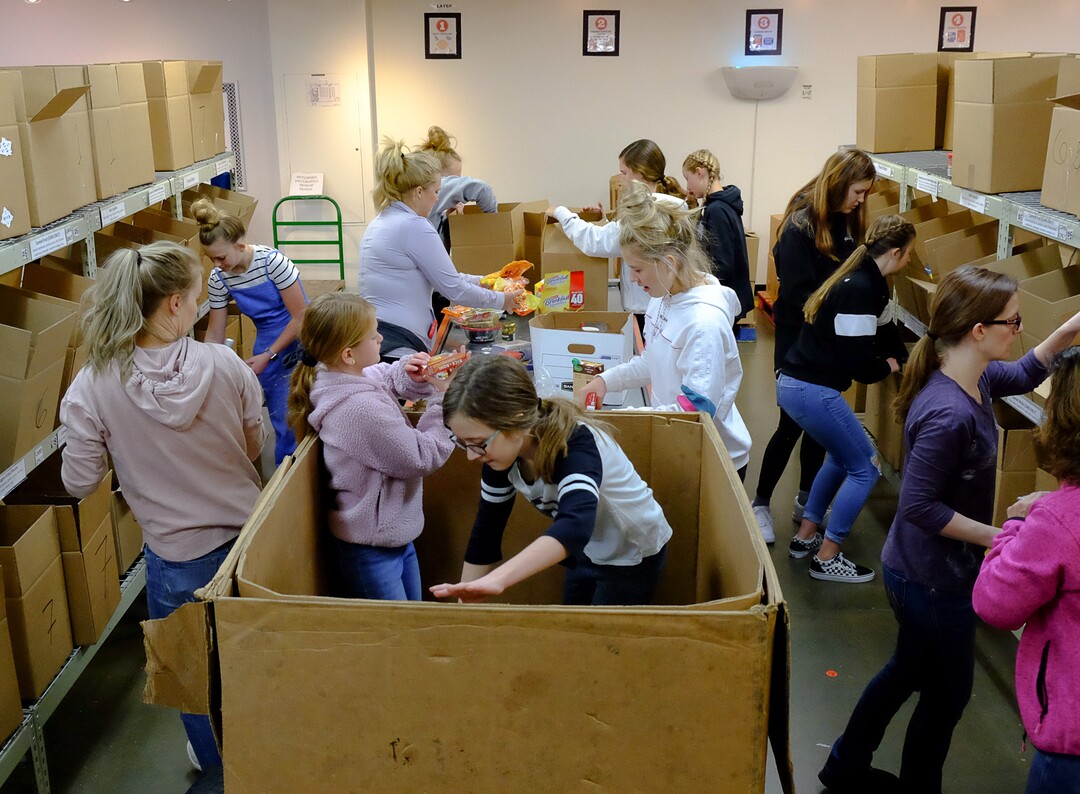 (Francisco Kjolseth  |  The Salt Lake Tribune) The community comes together during the coronavirus outbreak on Saturday, March 14, 2020, after hearing the Utah Food Bank is hurting for volunteers, since groups that normally volunteer canceled after the order of mass gatherings.