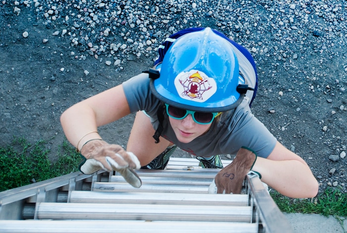 (Rick Egan  |  The Salt Lake Tribune)  Victoria climbs a ladder during a  firefighting skills relay while attending Camp Fury.  A dozen Utah Girl Scouts participated in a 3-day camp led by female firefighters. Camp Fury Utah was developed in partnership with the Girl Scouts and local fire and police departments, designed to expose teen girls to careers in public safety and other non-traditional jobs. Saturday, August 5, 2017.


