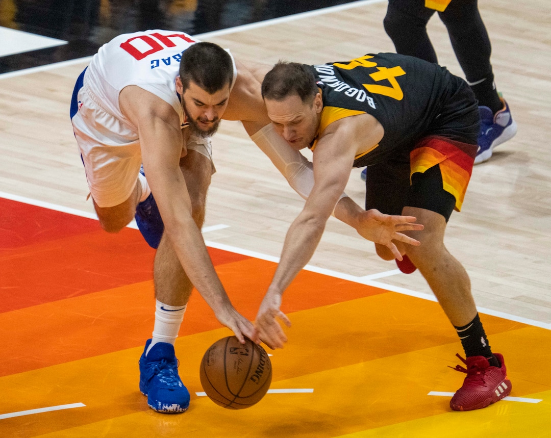 (Rick Egan | The Salt Lake Tribune) Utah Jazz forward Bojan Bogdanovic (44) knock the ball out of the hands of LA Clippers center Ivica Zubac (40), in second round playoff action in game 2 between the Utah Jazz and the LA Clippers, at Vivint Arena, on Thursday, June 10, 2021.